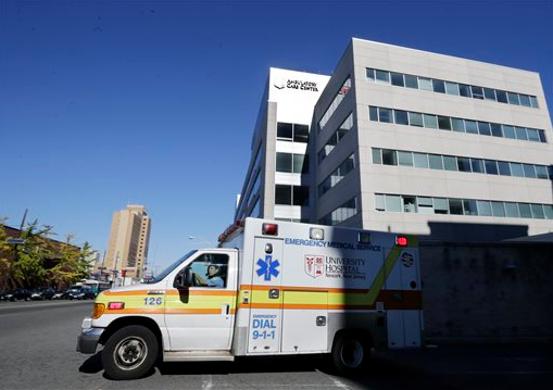 An ambulance drives near University Hospital of Newark on Monday. Nurse Kaci Hickox, who was quarantined there after working in West Africa with Ebola patients, was released Monday and left the hospital in a private vehicle. AP Photo/Mel Evans