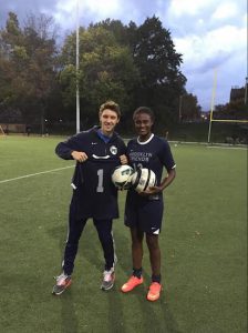 Sophomore Halima Matthews, shown here with head girls’ soccer coach Gary Lawson, reached the 100-goal mark in only her third varsity season as Brooklyn Friends advanced to Thursday’s ISAL Championship Game for the third straight year. Photo courtesy of BFS Athletics