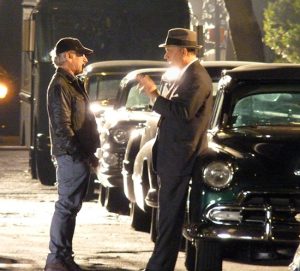 Steven Spielberg (left) converses with Tom Hanks (right) on the set of “St. James Place” in Brooklyn Heights. Photo by Mary Frost