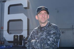 Seaman James P. Mallon, a graduate of Xaverian High School, is doing his best to get a new amphibious assault ship ready for service.