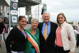 Mary Nolan (second from left) receives congratulations from her granddaughters Cara (left) and Caitlin and Hon. Justice John Ingram at the Great Irish Fair.