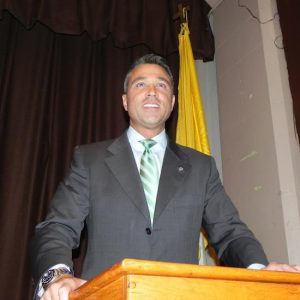 U.S. Rep. Michael Grimm, pictured at a debate last month in Bay Ridge, will go on trial in federal court on Feb. 2.