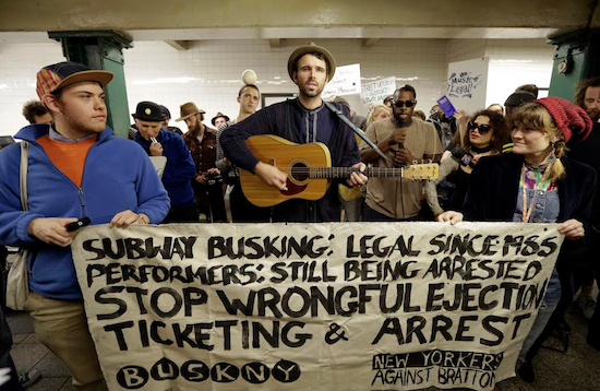 Andrew Kalleen joins other performers during a protest in the Metropolitan Avenue Subway station Tuesday in Brooklyn. Kalleen, 30, was performing on Oct. 17 at the G-train stop in Williamsburg when an officer told him he must leave the station because he needs a permit to play there. The New York Police Department says it's looking into the arrest.