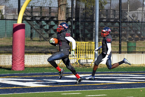 Several plays contributed to Erasmus Hall’s 26-14 victory over Fort Hamilton on Saturday, including a fumble recovered and returned for a touchdown by Aaron John (24). Eagle photo by Rob Abruzzese