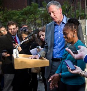 New York Mayor Bill de Blasio, center, stands next to first lady Chirlane McCray as they hold a news conference after voting in the midterm elections on Nov. 4. AP Photo/Bebeto Matthews