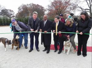 Brooklyn Parks Commissioner Kevin Jeffrey (center) joins dog owner Rick Gimeranez, Assemblymember Alec Brook-Krasny, Councilmember Vincent Gentile, Brook-Krasny’s chief of staff Kate Cucco, and Community Board 10 District Manager Josephine Beckmann (left to right) at the ribbon cutting. Eagle photos by Paula Katinas