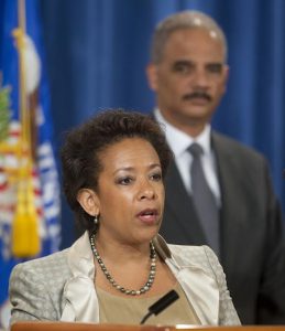In this July 28, 2014, file photo, current Attorney General Eric Holder, right, listens to, Loretta Lynch, left, U.S. Attorney for the Eastern District of New York. AP Photo/Pablo Martinez Monsivais, File