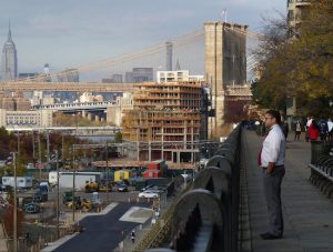 As seen in this photo taken from the Brooklyn Heights Promenade near Montague Street, a 30-foot structure built atop the Pierhouse drastically compromises the protected view plane of the Brooklyn Bridge, according to Martin L. Schneider and Beverly Moss Spatt. "It now stands as a flagrant abrogation of the 2005 understanding," they write. Eagle photo by Mary Frost
