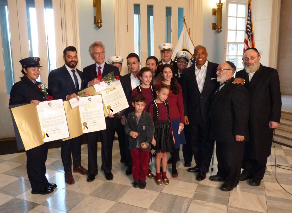 Ceremony at Brooklyn Borough Hall honors heroes who helped save stabbing victim. Photo by Mary Frost