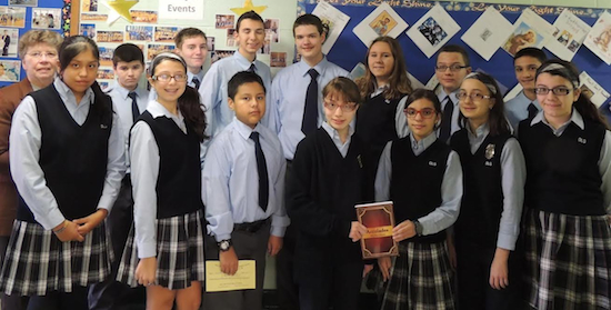 Sister Delores F. Crepeau, (far left) principal of Our Lady of Guadalupe School, congratulates student poets whose work appears in a new book, “Accolades.” Photo courtesy Our Lady of Guadalupe School