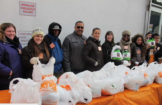 Food Bank Of New York workers in Flatbush on Thursday morning, helping give kosher turkeys to those in need. Photo by Matthew Taub