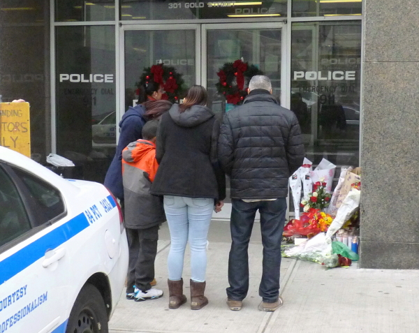 Grief at Downtown Brooklyn's 84th Precinct, on Sunday. Photo by Mary Frost