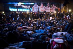 Protestors participated in a die-in in front of the Barclays Center on Monday night. AP Photo/John Minchillo