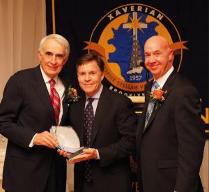 Sports broadcaster Bob Costas (center) made a surprise visit to Xaverian High School’s annual gala so that he could be on hand to present his friend, Dr. Andrew Fiore (left) with an award. At right is Xaverian President Robert Alesi. Photo courtesy Carl Gachet Photography
