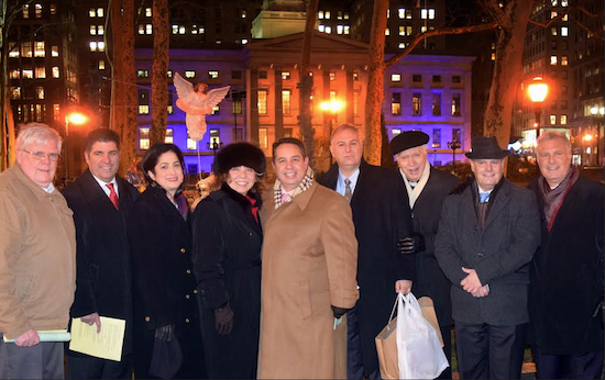 Members of the Catholic Lawyers Guild met in front of the Kings County Supreme Court in Downtown Brooklyn on Thursday to celebrate the Christmas season. Pictured left to right: Thomas Fitzgerald, Dominic Famulari, Sara J. Gozo, Hon. Lizette Colon, Joseph Rosato, Dean G. Delianites, Father Peter Mahoney, Gregory Laspina and Gregory T. Cerchione. Eagle photos by Rob Abruzzese