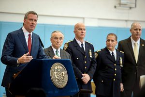 Mayor Bill de Blasio (left) and Police Commissioner Bratton (second from left) announced on Tuesday that crime in NYC was way down over the past four months. Photo by Demetrius Freeman/Mayoral Photography Office