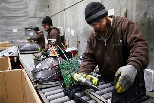 Electronic waste now gets recycled in plants like this one in Lynnwood, Wash. AP Photo/The Herald, Genna Martin