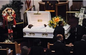 Eric Garner's body lies in a casket during his funeral at Bethel Baptist Church in Brooklyn on July 23. Garner's family is suing NYC for $75 million. AP Photo/New York Daily News, Julia Xanthos, Pool