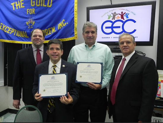Paul Cassone (left), executive director and CEO of the Guild for Exceptional Children, says the Guild has no choice but to close its early childhood program. He is pictured in a photo taken last year with Councilmember Vincent Gentile, former councilmember Domenic Recchia, and Guild Vice President Anthony Cetta (left to right). Eagle photo by Paula Katinas