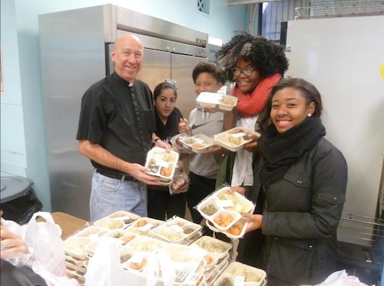 The Rev. Paul Knudsen, pastor of Bethlehem Lutheran Church, and Fort Hamilton High School students made Thanksgiving a little less lonely for homebound senior citizens by delivering turkey dinners to them on Thursday. The meal distribution was coordinated by the Bay Ridge Center, which runs senior citizen programs. Photo courtesy of Bay Ridge Center