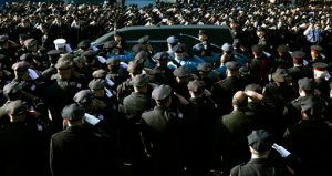 Police officers salute as the hearse of New York city police officer Rafael Ramos drives along his funeral procession route in the Glendale section of Queens on Saturday. Ramos and his partner, officer Wenjian Liu, were killed Dec. 20 as they sat in their patrol car on a Brooklyn street. The shooter, Ismaaiyl Brinsley, later killed himself. AP Photo/John Minchillo