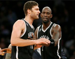 Brook Lopez and Kevin Garnett combined to grab 21 of the Nets’ 49 rebounds Tuesday night against the dismal Knicks. AP photos