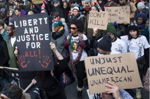 Protests raged in NYC on Saturday. AP Photo/John Minchillo