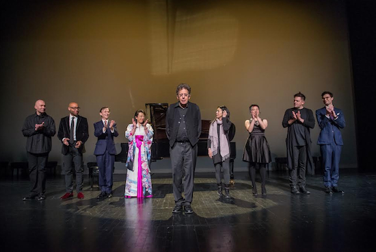 Nine pianists joined Philip Glass at BAM to perform Glass' piano etudes. From left: Anton Batagov, Aaron Diehl, Bruce Levingston, Maki Namekawa, Philip Glass, Jenny Lin, Sally Whitwell, Nico Muhly and Timo Andres. Not pictured: Tania Leon. Photo by Stephanie Berger, courtesy of BAM