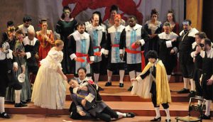 Renato (Peter Hakjoon Kim, kneeling) holds the dying Riccardo (Michael Morrow, lying down).  Amelia (Alexis Cregger, front left) and Oscar (Mizuho Takeshita, front right) look on in sadness. Photo by George Schowerer