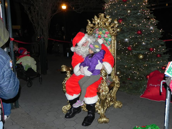 Santa arrived at Shore Road Park just after the tree was lit. He was mobbed by children all wanting to tell him what they want for Christmas. Eagle photos by Paula Katinas