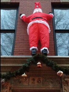 Is this Santa, or Spider-Man in disguise? This inflatable Christmas decoration brings a touch of whimsy to Brooklyn Heights. Eagle photos by Lore Croghan