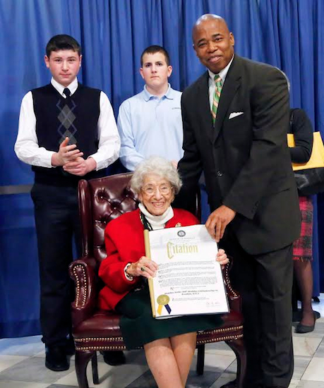 Brooklyn Borough President Eric L. Adams recognizes Madeline Scotto, a 100-year-old math teacher at St. Ephrem School in Dyker Heights, as November’s “Hero of the Month”, during a press conference at Brooklyn Borough Hall that cited her for her long and distinguished career in education; also pictured are (from left to right) Anthony Pollari and Jack Lavelle, two of her eighth-grade students. Photo Credits: Kathryn Kirk/Brooklyn BP’s Office