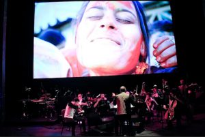Vijay Iyer and a full orchestra interpret a silent film about the springtime Hindu holiday of Holi. Photos by Rahav Segev, courtesy of BAM