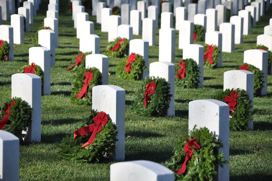 The graves of many military service members are now adorned with Christmas wreaths, thanks to volunteers from Viking Love. Photo by Teri Brennan