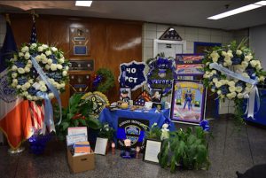 In the weeks following the deaths of NYPD Detectives Wenjian Liu and Rafael Ramos, the 84th Precinct has been flooded with flowers, food, sympathy cards and other gifts as people pay their respects to the fallen officers. Eagle photos by Rob Abruzzese