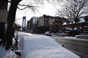 Streets are mainly clear on Tuesday on 96th Street and 3rd Avenue in Bay Ridge, with the Verrazano Bridge in sight. Photo by Rob Abruzzese