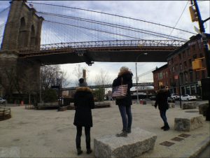 Tourists take in the two bridges — and 1 Old Fulton St., seen at right, which housed a dining saloon and hotel called Franklin House in the 19th Century. Eagle photos by Lore Croghan