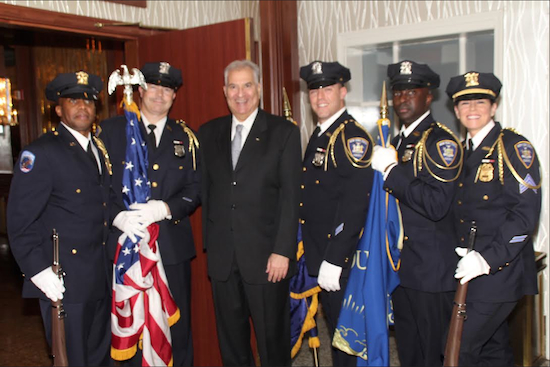 Hon. Bruce Balter is shown with the Court Officer Honor Guard. ﻿Eagle photo by Mario Belluomo