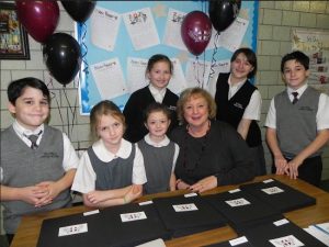 Rosemarie McGoldrick, principal of Holy Angels Academy, and her students welcomed visitors to an Open House at the Bay Ridge school on Sunday. Pictured with McGoldrick are Jonathan Mundy, Emma Bolino, Caroline Chelales, Anna Bolino, Meaghan Delle Cave and Daniel Mundy (left to right). Eagle photo by Paula Katinas