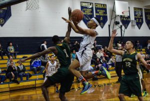 Head coach Jack Alesi called Doyin Isaac (pictured in white) the straw that stirs the drink at Xaverian High School in Bay Ridge. Eagle photo by Rob Abruzzese