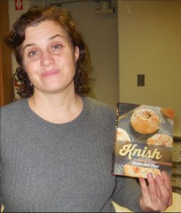 Brooklyn resident Laura Silver holds a copy of “Knish: In Search of the Jewish Soul Food” prior to her talk at the Brooklyn Heights library branch.