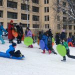 Hundreds of kids jammed Squibb Hill in Brooklyn Heights Monday, shrieking with delight as they flew down the slope on sleds, flying saucers and snow tubes. Photos by Mary Frost