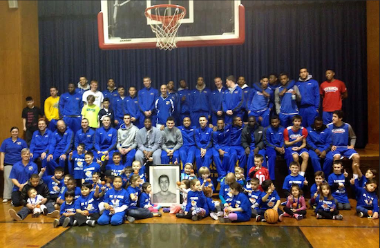 Basketball players and kids had fun at last year’s “Swish for Kids” event. The children in front are holding a portrait of Francesco Loccisano, whose death inspired his mother to start a foundation in his memory. Photo courtesy St. Ephrem Basketball/Youth Program