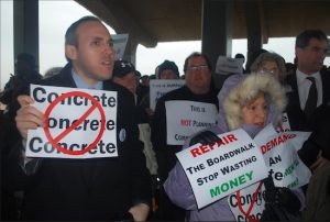 Councilmember Mark Treyger (left) and local residents protested work being done by the city to replace wooden sections of the boardwalk with concrete. Photo courtesy Treyger’s office