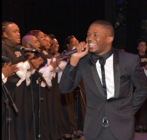 Vincent Bohanan joyfully conducts the Sounds of Victory Choir. Photo credit: Alston Media Group