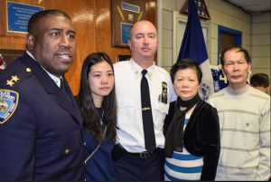 The 84th Precinct honored the memory of two fallen police officers with plaques that were unveiled in the precinct. Pictured are Assistant Chief Jeffrey Maddrey (left) and Cap. Sergio Centa (center) with the family of fallen Detective Wenjian Liu: wife Pei Xia Chen, mother Xiu Yan Li and father Wei Tang Liu. Eagle photos by Rob Abruzzese