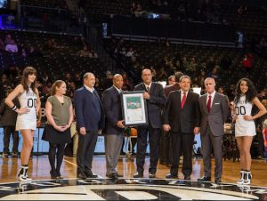 Eric Adams is presented with the Martin Luther King Jr. Award by Ambassador Ido Aharoni, Russell Robinson of the Jewish National Fund and Hindy Poupko of the Jewish Community Relations Council of New York at Barclays Center. Pictured are Poupko; Bruce Ratner, Barclays Center majority owner; Adams; Aharoni; Robinson; and Brett Yormark, CEO of the Brooklyn Nets and Barclays Center. Photo by Tal Atzmon