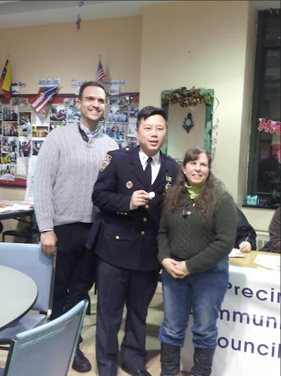 Sunset Park BID President Llamil Nunez, (left) and Executive Director Renee Giordano recently presented a “challenge coin” to 72nd Precinct Capt. Tommy Ng. Photos courtesy of Sunset Park BID