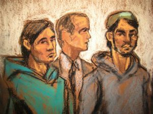 In this courtroom drawing, defendant Akhror Saidakmetov, left; an interpreter, center; and defendant Abdurasul Hasanovich Juraboev, appear at federal court in New York on terrorism charges on Wednesday. Saidakmetov and Juraboev are two of the three men arrested on charges of plotting to travel to Syria to join the Islamic State group and wage war against the U.S. AP Photo/Jane Rosenberg