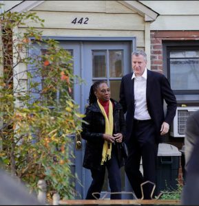 In this Nov. 6, 2013, photo, Bill de Blasio and his wife, Chirlane McCray, leave their house in Park Slope. While the mayor and his family now reside at Gracie Mansion in Manhattan, de Blasio still frequents the Prospect Park YMCA in his old neighborhood. AP Photo/Mark Lennihan